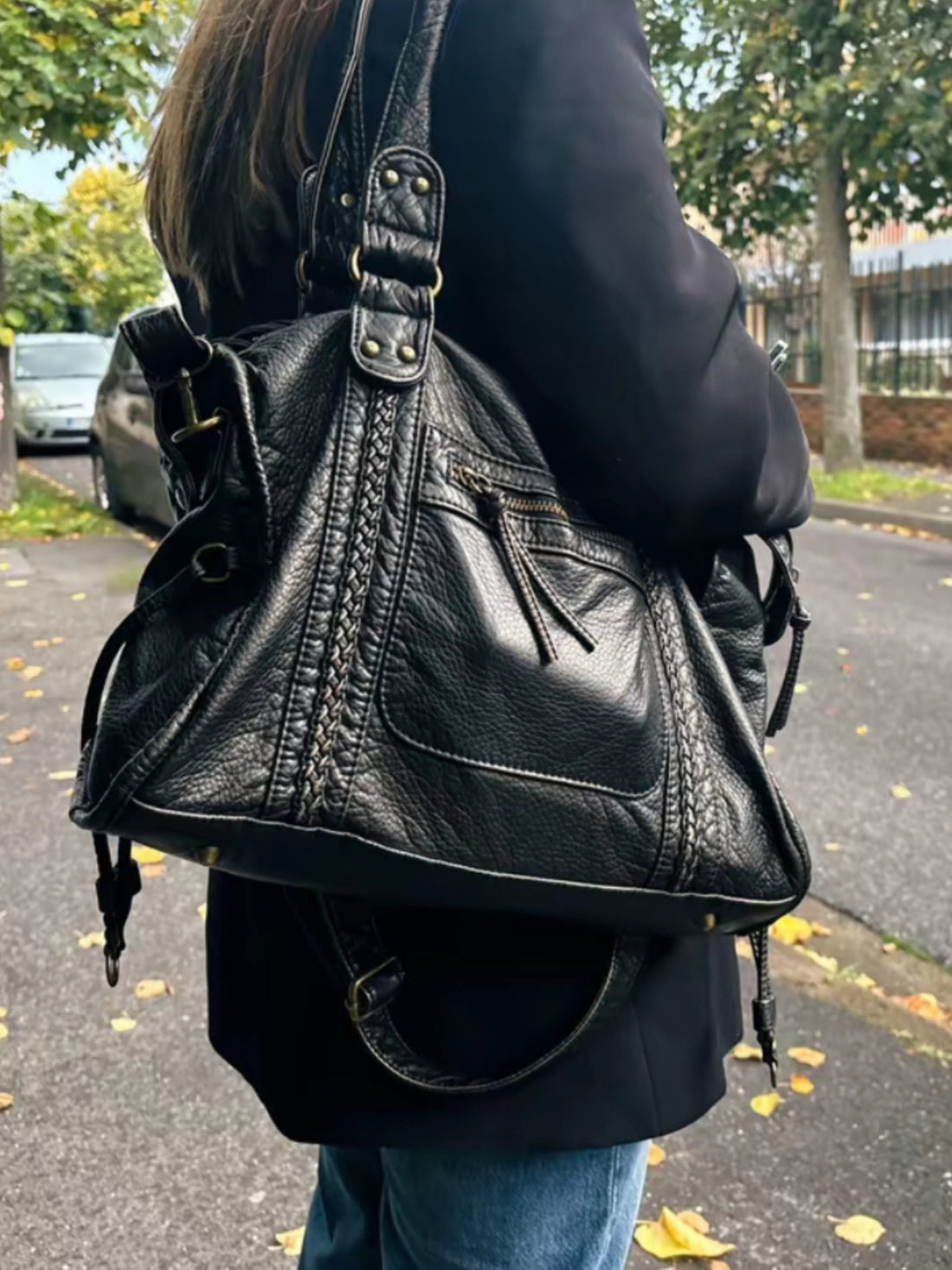Black Leather Shoulder Bag with Braided Trim and Side Ties