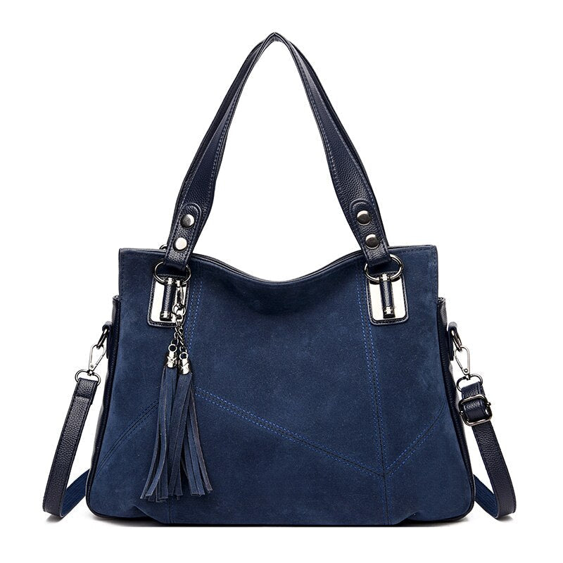 Suede Shoulder Bag with Panel Stitching and Tassel Detail